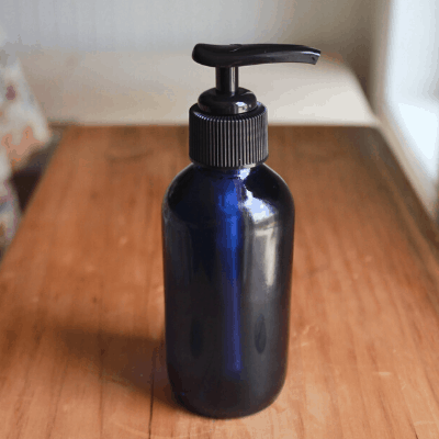 blue glass bottle with DIY shaving & body oil