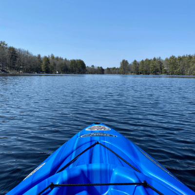 blue kayak on the lake pictured from sitting inside