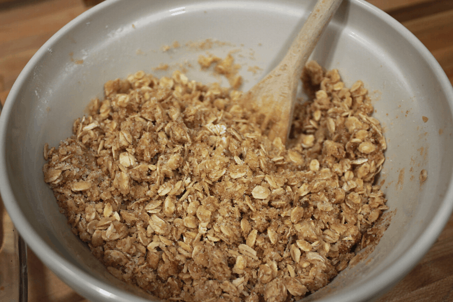 homemade crisp mixture in a ceramic mixing bowl